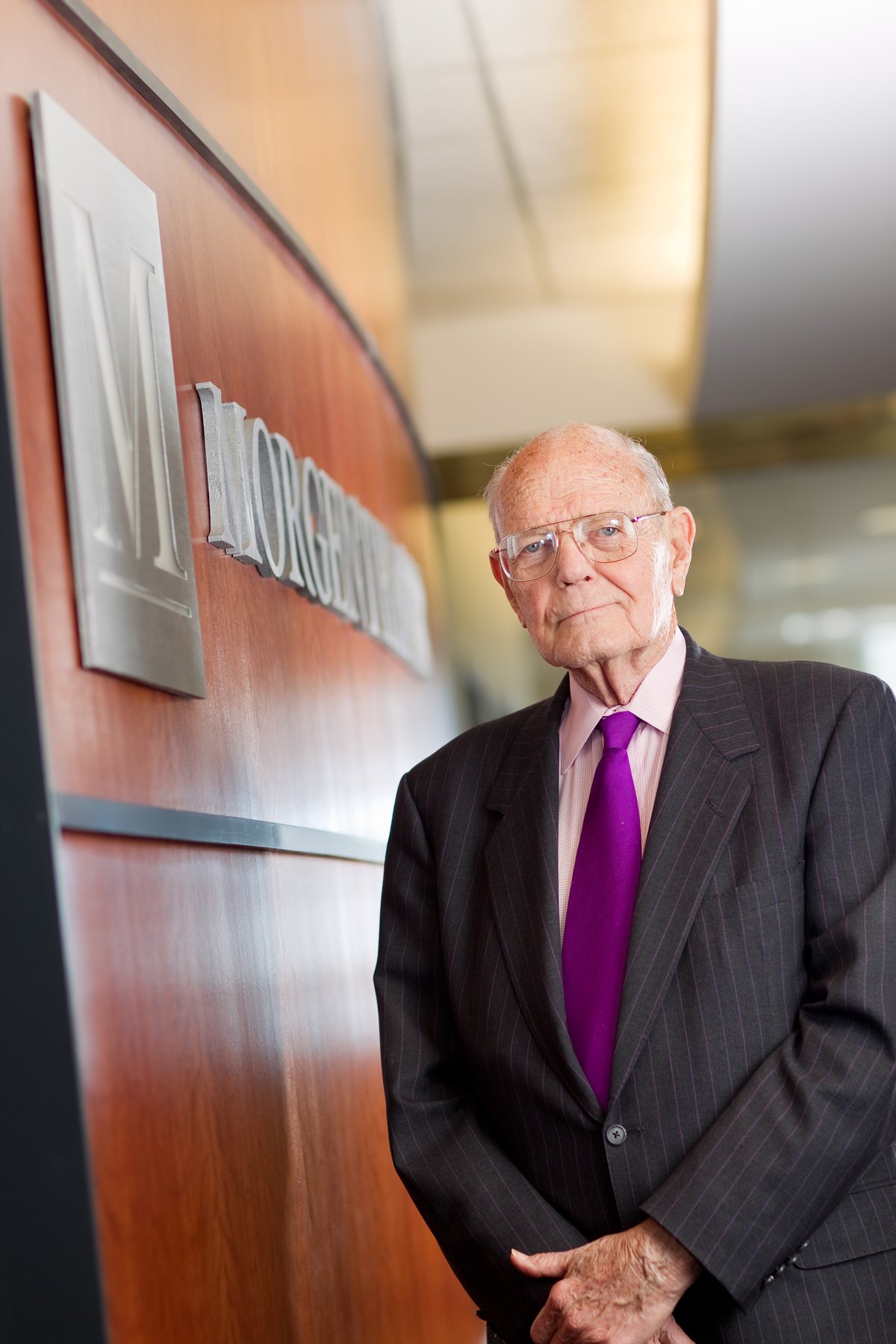 David Morgenthaler standing beside the Morgenthaler firm sign